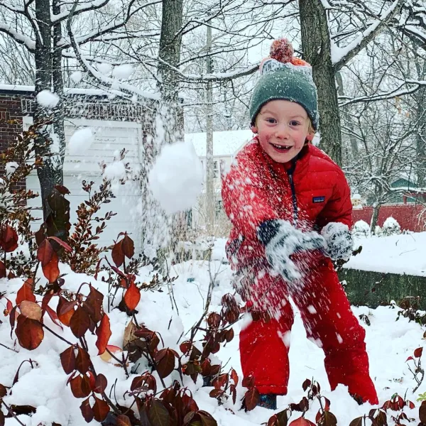Child throwing a snow ball