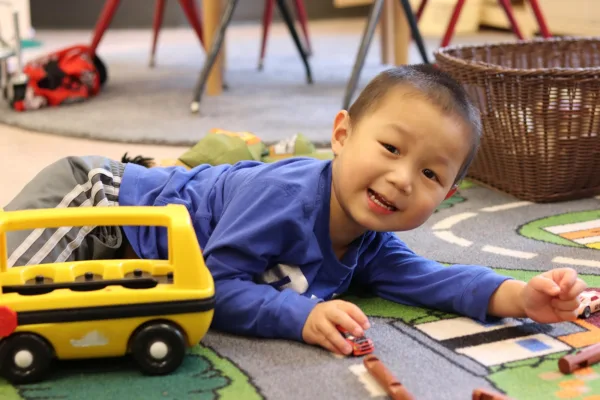 A child playing with cars
