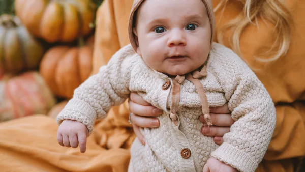 Baby in a pumkin patch