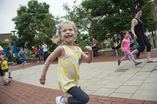 Child running and smiling