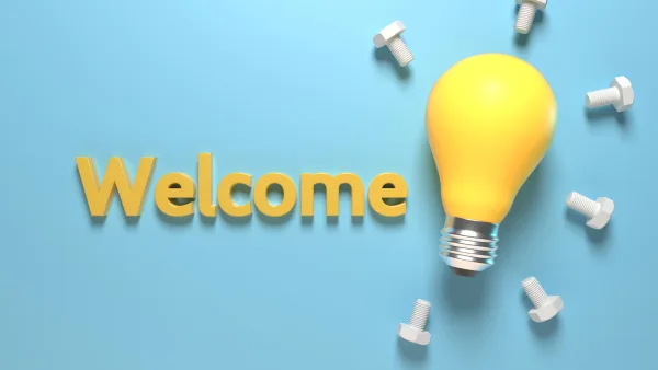 The word welcome next to a lightbulb and bolts